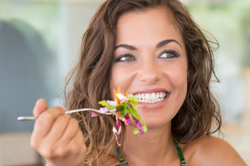 Woman eat salad